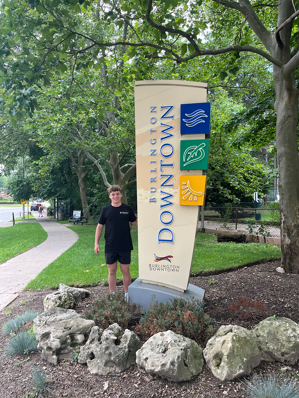 Aspect founder at the Burlington welcome sign