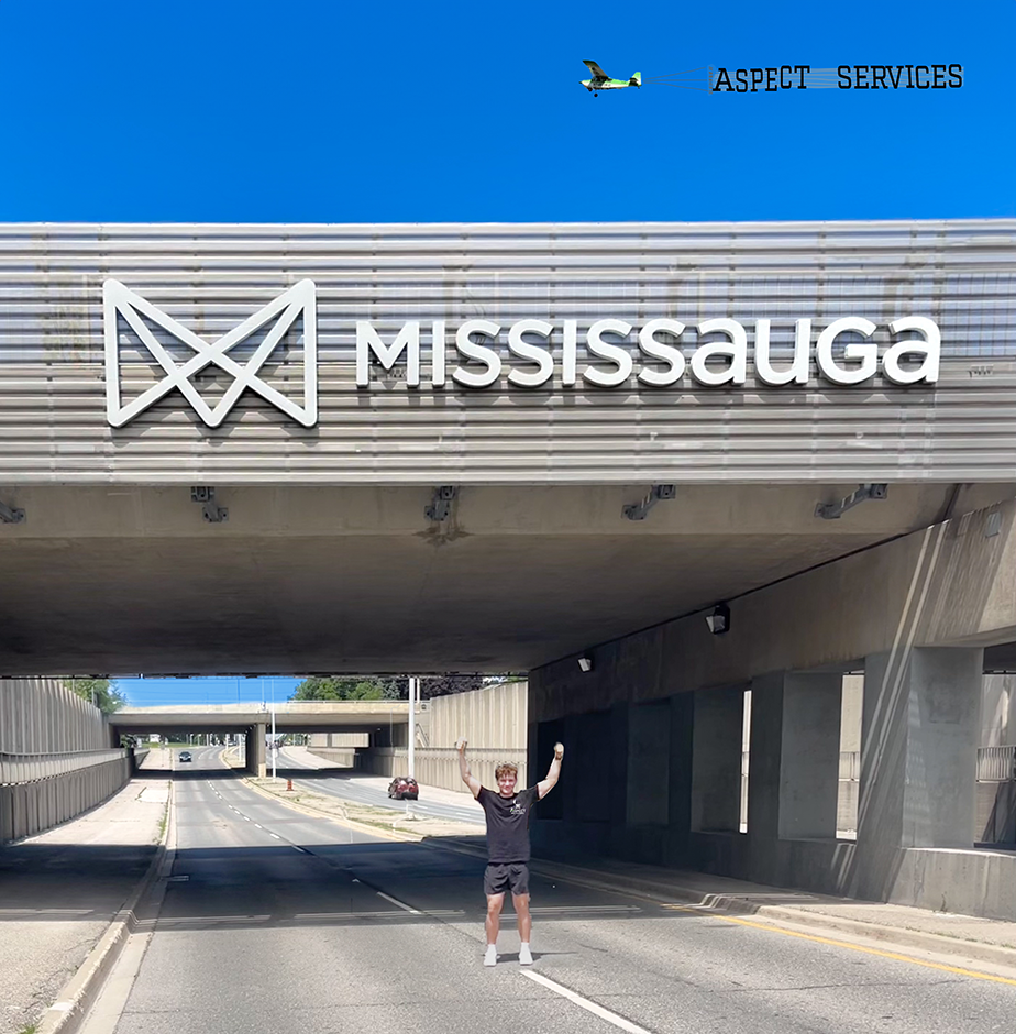 Aspect founder at the Mississauga welcome sign