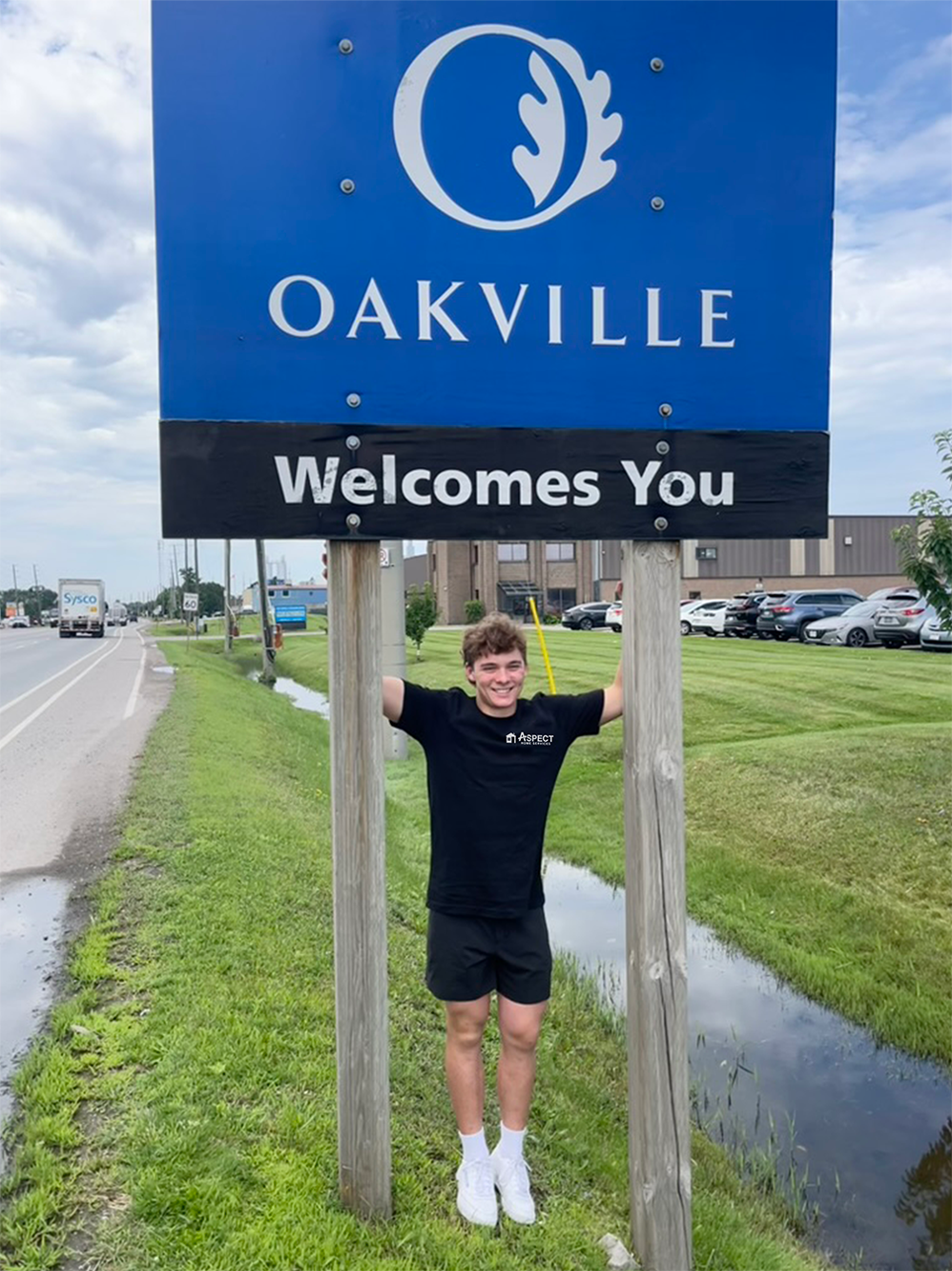 Aspect founder at the Oakville welcome sign
